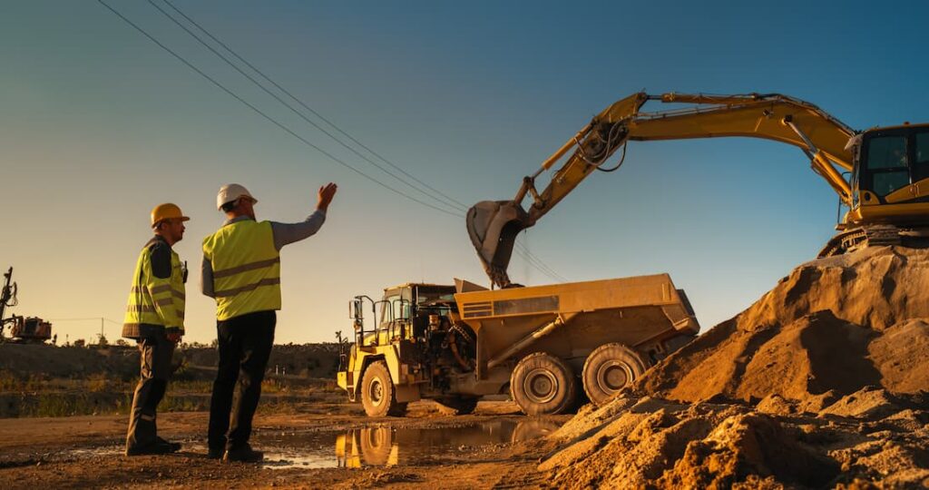 Business owner examines new construction equipment for leasing