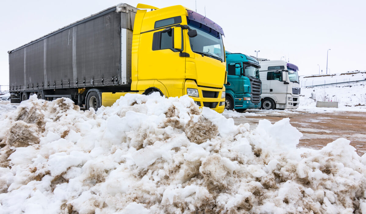 Trucks stopped at rest stop amidst snow