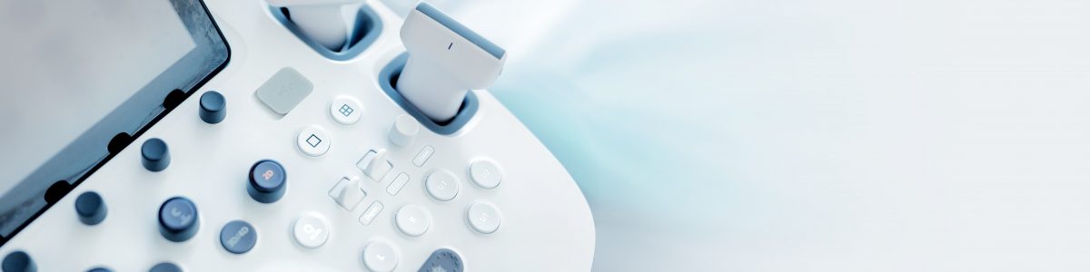 Modern equipment. An ultrasound device and a couch. close up of an ultrasound machine